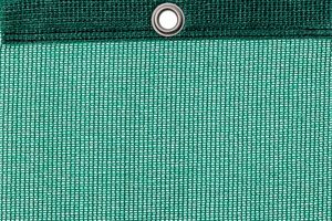 Detail picture of PE air permeable cover, dark green, with eyelet and border on top