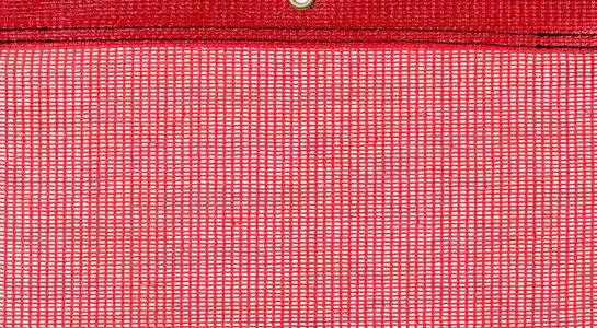 Detail picture of PE air permeable cover, 200 g, red, with eyelet and border on top