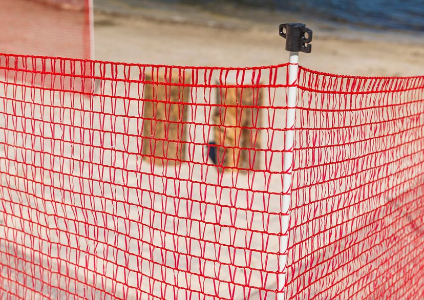 Integrated post in red barrier fence, detail picture
