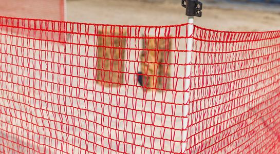 Integrated post in red barrier fence, detail picture