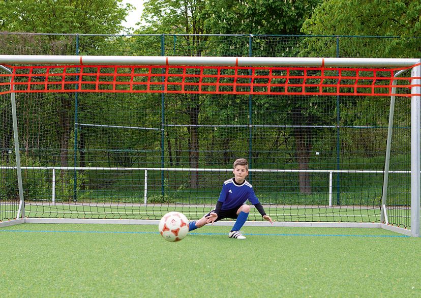 Junior goal with orange reduction made of webbing net